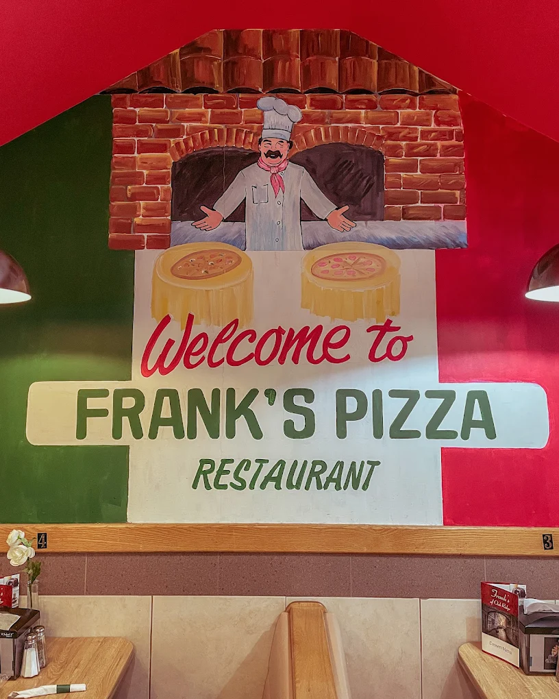 Welcome to Frank's Pizza mural inside the restaurant